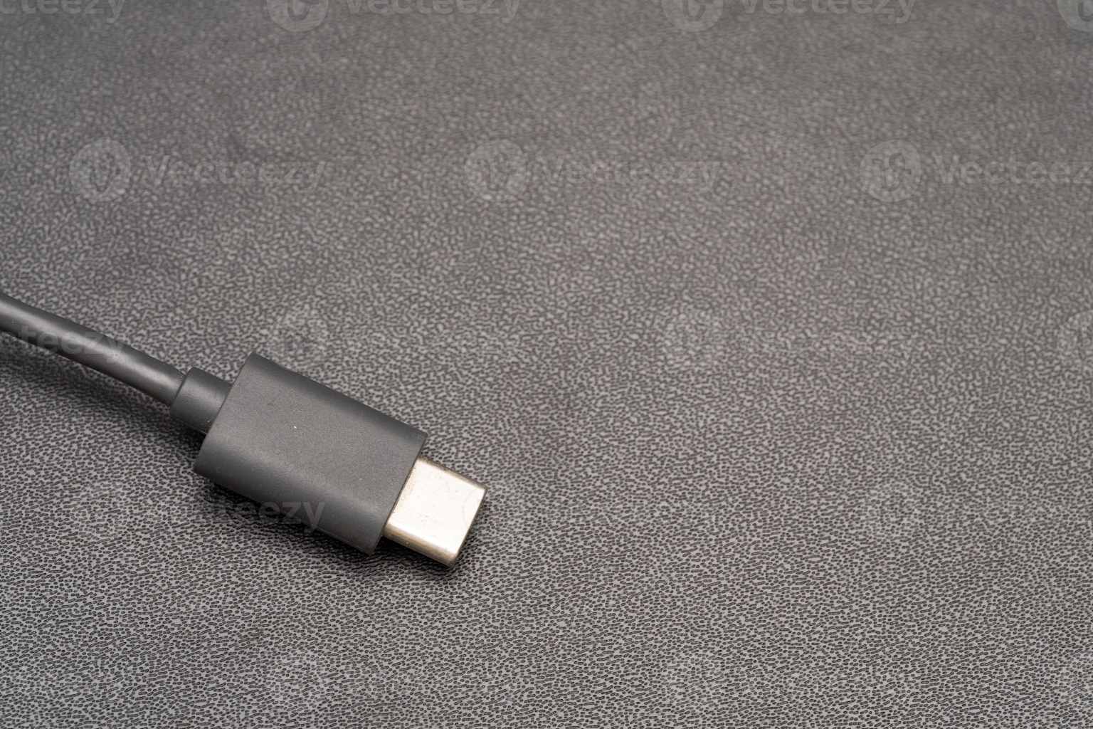 A USB-C connector — a small rounded oval plug